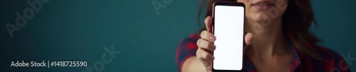 Woman points finger at blank mobile screen with accusatory expression, gesture, warning, smartphone photo