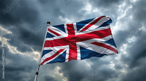 british flag waving in the wind of the storm sky