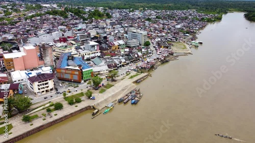 Aerial Majesty of Quibdó: River, Faith, and Rainforest. Drone views of Quibdó, Choco, Colombia, featuring the Atrato River, boats, rainforest, and the iconic cathedral. A vibrant mix of nature.