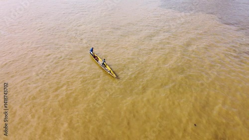 Aerial Majesty of Quibdó: River, Faith, and Rainforest. Drone views of Quibdó, Choco, Colombia, featuring the Atrato River, boats, rainforest, and the iconic cathedral. A vibrant mix of nature.