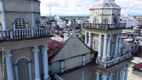 Aerial Majesty of Quibdó: River, Faith, and Rainforest. Drone views of Quibdó, Choco, Colombia, featuring the Atrato River, boats, rainforest, and the iconic cathedral. A vibrant mix of nature.