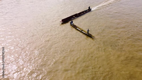 Aerial Majesty of Quibdó: River, Faith, and Rainforest. Drone views of Quibdó, Choco, Colombia, featuring the Atrato River, boats, rainforest, and the iconic cathedral. A vibrant mix of nature.