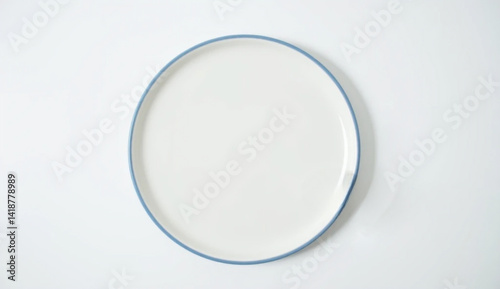Flat white spoon with blue rimmed plate