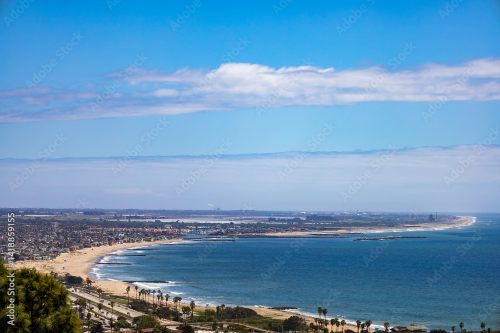 a stunning shot of the coastline with beaches, homes and lush green trees in Ventura California USA a stunning shot of the coastline with beaches, homes and lush green trees in Ventura California USA