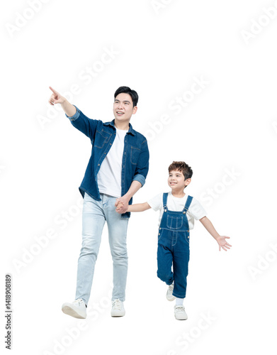 Full body image of Asian father and son walking and posing on white background