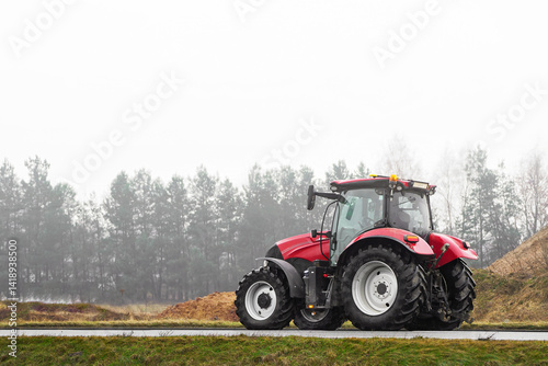 Obraz na płótnie Tractor on foggy road in rural farming area w salonie