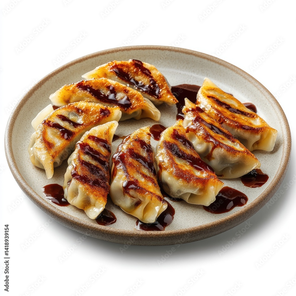A plate of eight pan-fried dumplings with a brown sauce drizzle A plate of eight pan-fried dumplings with a brown sauce drizzle