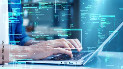 Close-up of hands typing on a laptop with holographic code and digital data interface overlays, symbolizing software development and coding.