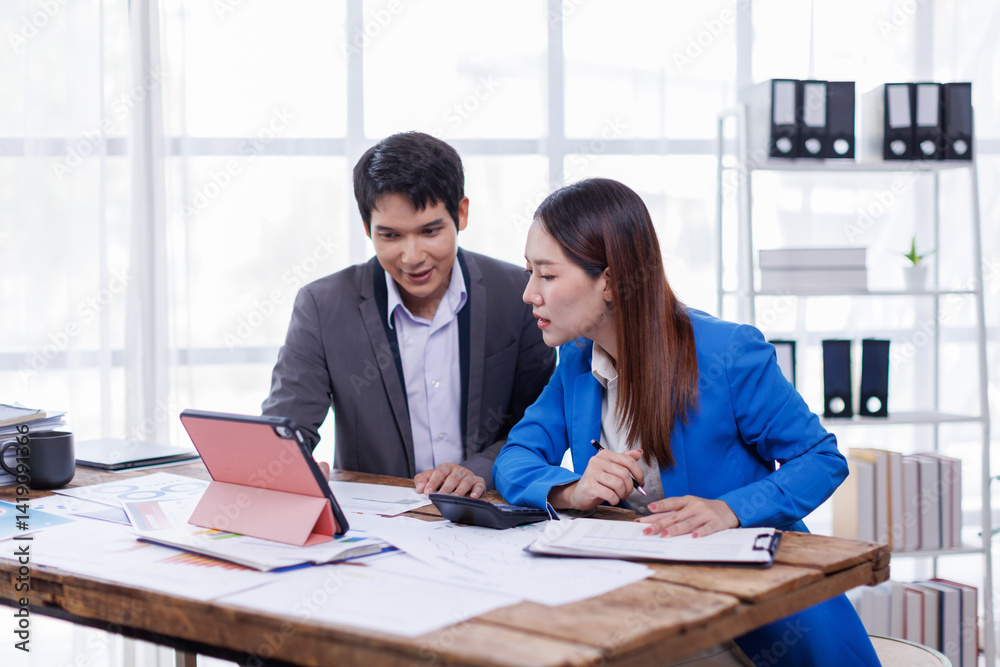 Team of Accounting business are calculating income-expenditure and analyzing real estate investment data on tablet computer, Financial and tax systems concept.
Team of Accounting business are calculating income-expenditure and analyzing real estate investment data on tablet computer, Financial and tax systems concept.