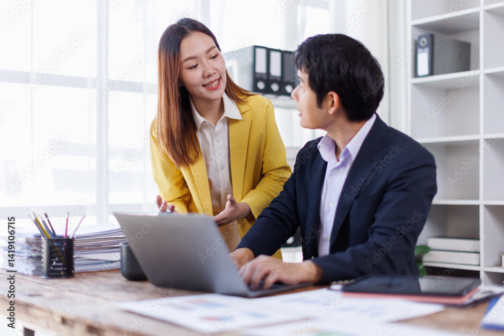 Two happy asian employees working together using computer planning project. business woman consulting teaching young employee looking at laptop sitting at desk in office
Two happy asian employees working together using computer planning project. business woman consulting teaching young employee looking at laptop sitting at desk in office