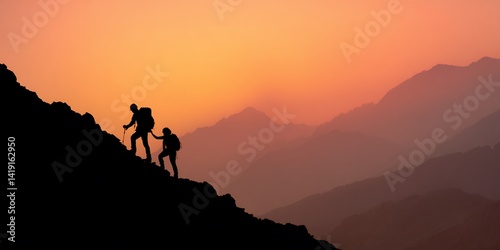 Hikers ascend a mountain at sunrise
