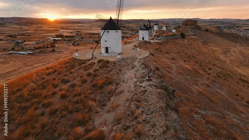 Aerial view of the windmills of Consuegra at sunset, Castilla-La Mancha, Spain.