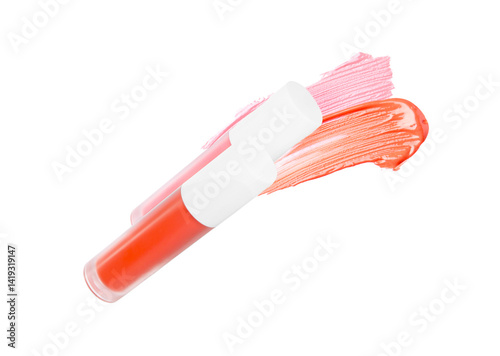 Tubes of lip gloss and samples isolated on white
