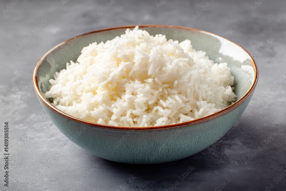 Bowl of rice looks appetizing and delicious. Simple food composition with fluffy white rice, culinary staple that evokes sense of comfort and wholesome goodness Bowl of rice looks appetizing and delicious. Simple food composition with fluffy white rice, culinary staple that evokes sense of comfort and wholesome goodness