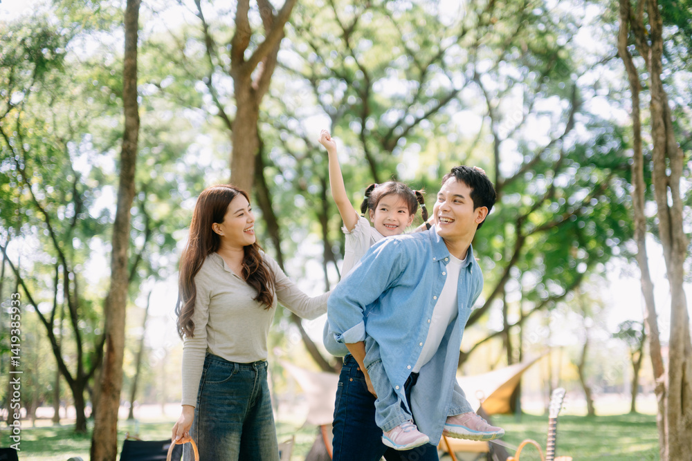 Happy parents and daughter Bakery and Bread Fruit enjoy in a sunny garden. A joyful summer picnic full of love, food for family Happy parents and daughter Bakery and Bread Fruit enjoy in a sunny garden. A joyful summer picnic full of love, food for family