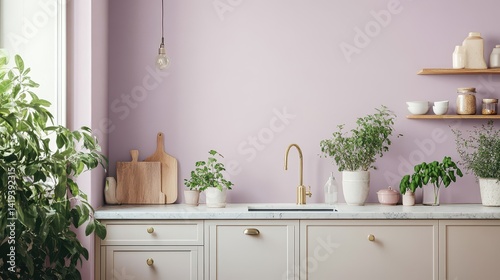 Bright kitchen featuring pink walls and numerous potted plants