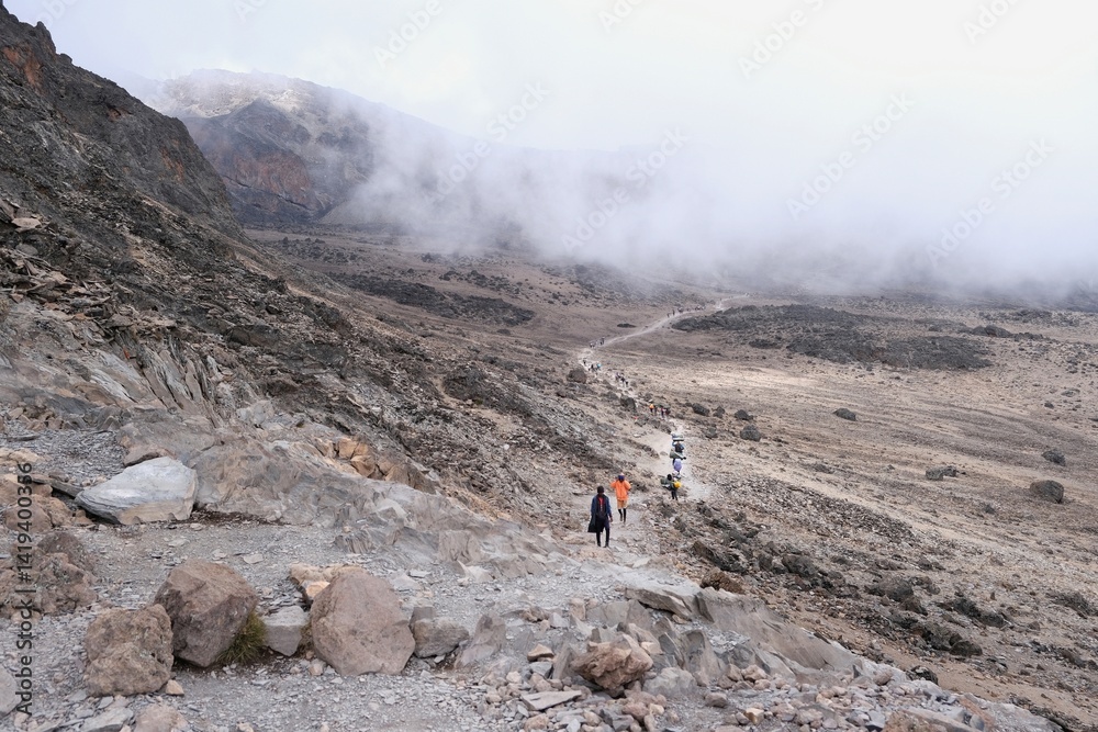 Group fo trekking people on trail from Barranco Hut to Barafu Camp, during trekking to Kilimanjaro Peak, Machame Route, Tanzania