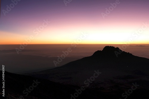 Obraz na płótnie Sunset scenery with Mawenzi Peak on horizon during climbing to Uhuru peak on Kibo volcano (Kilimanjaro) – 5895 m. Tanzania w salonie