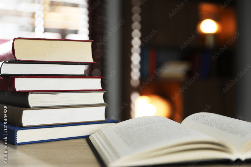 Fototapeta premium Many different books on table against blurred background. Space for text