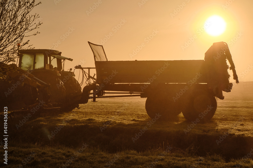 Fototapeta premium Misty Sunrise Over Tractor in Wormer, Low Holland Farmland Scene