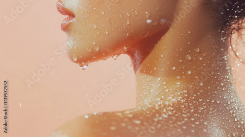 A woman with her head tilted back and water dripping from her face