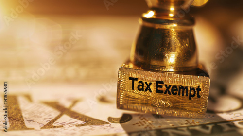 Golden tax exempt stamp pressed on official document with copy space, financial approval concept, government tax relief policy and legal exemption certification for business.