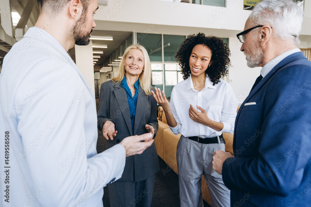 Obraz premium Diverse business team, multinational colleagues engaging in discussion working in modern office