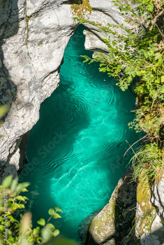 Obraz na płótnie Emerald alpine water of Soca mountain river in Slovenia, Triglav National Park w salonie