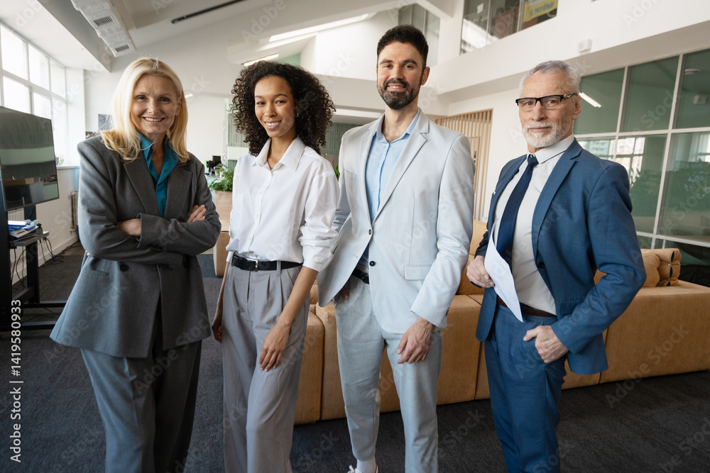 Smiling business people posing together in modern office Smiling business people posing together in modern office
