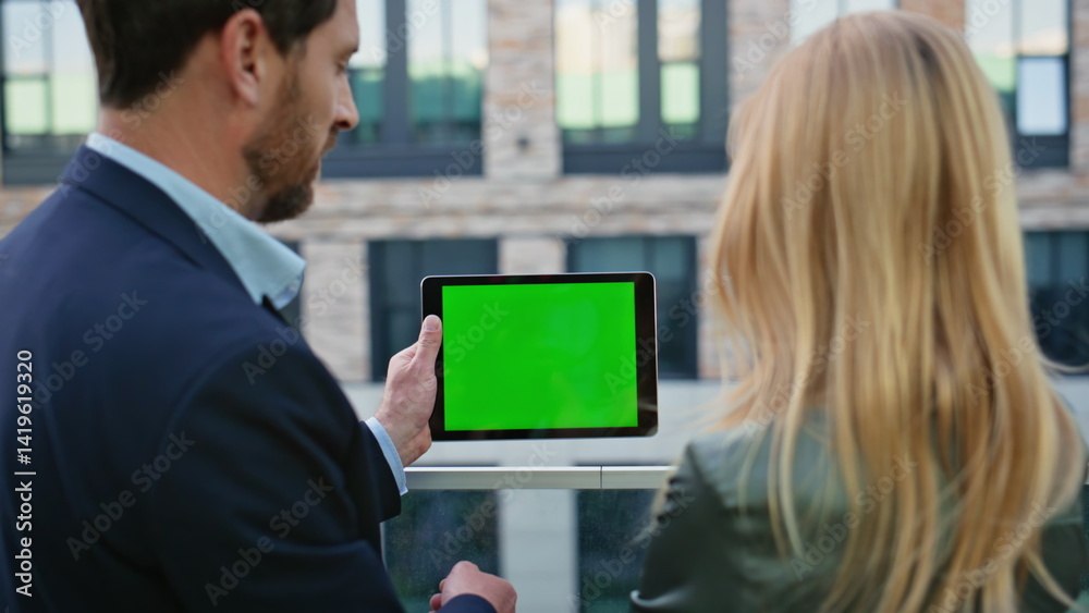 Formal couple discussing mockup tablet at street closeup. Business team working