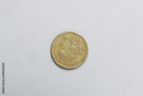 Obraz na płótnie Indonesian gold rupiah metal coin money w salonie