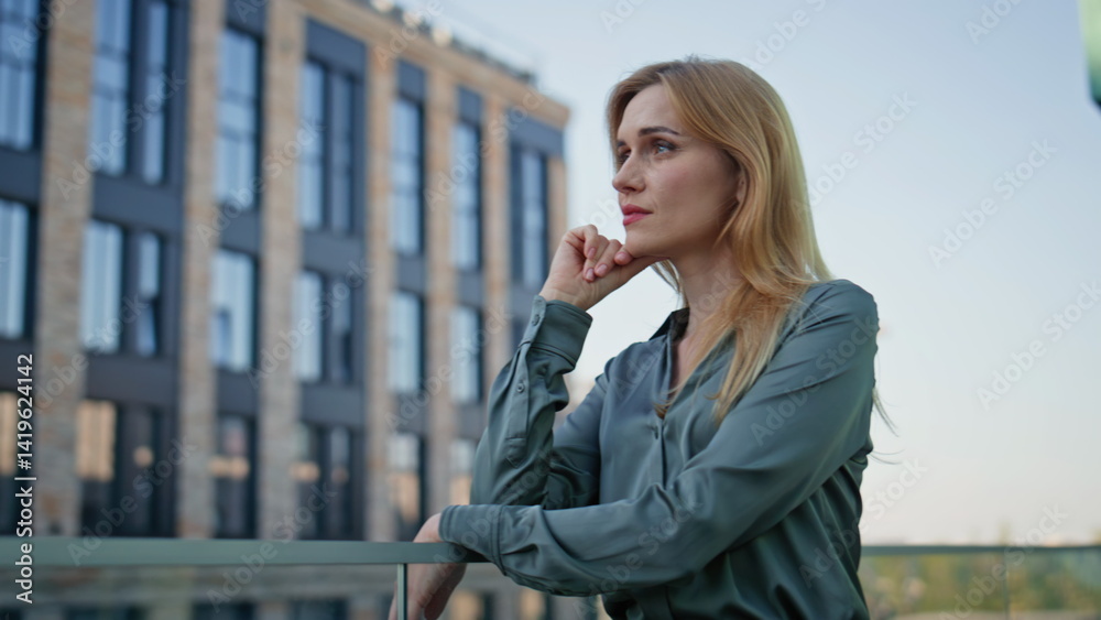 Pensive manager watching city view office district closeup. Woman thinking work