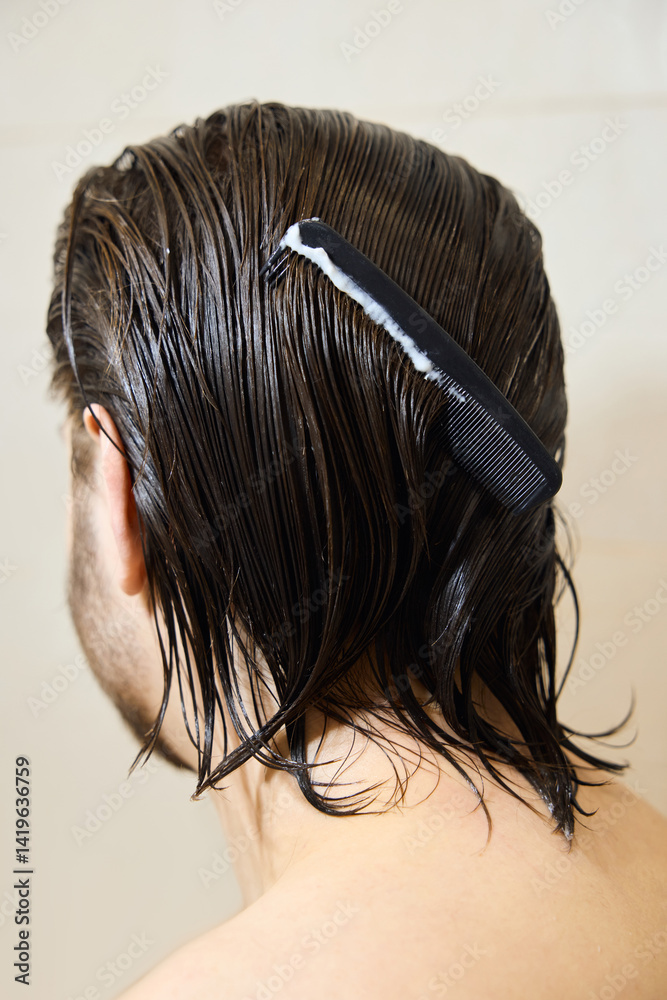 Naklejka premium a brunette with long hair applies hair balm, caring for them