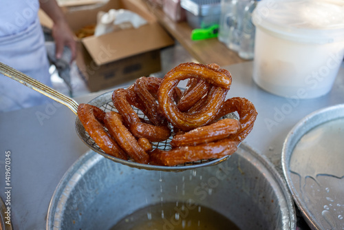 Traditional Turkish ring sweet dessert Halka Tatli. Fried circle desserts. photo