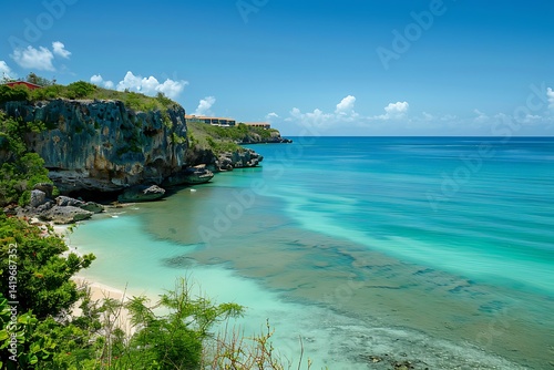Scenic Coastal View With Turquoise Waters And Rocky Cliffs Under Clear Blue Sky