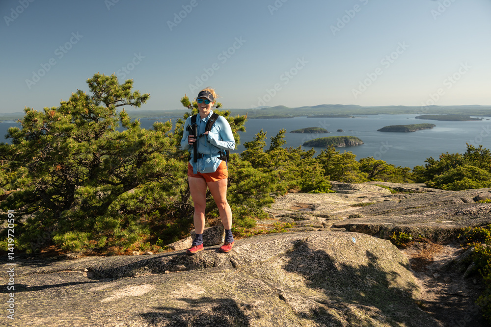 Woman Smiles on Rocky Trail in Acadia