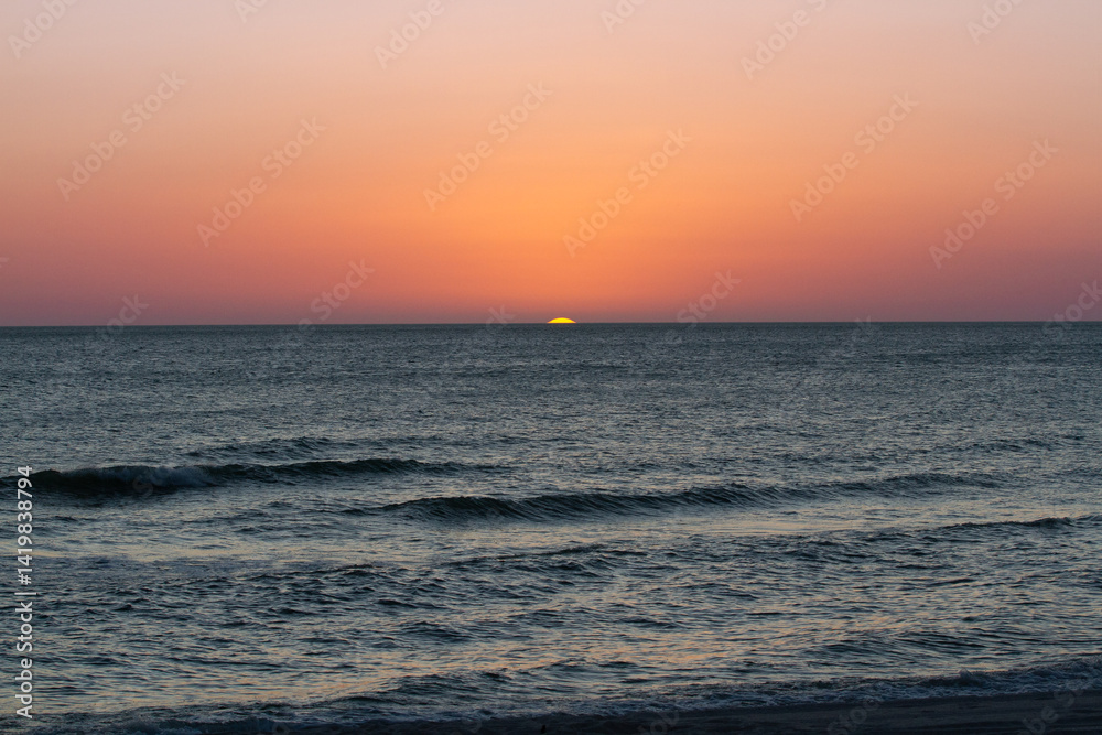 Fototapeta premium Sunsets Over Beaches, Palm Trees and Oceans