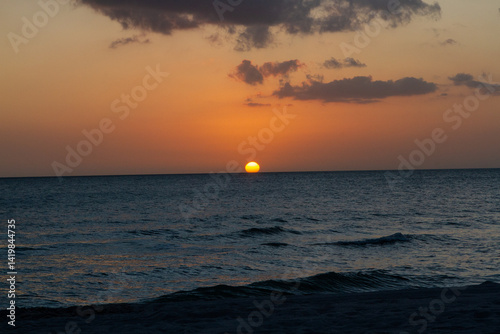 Sunsets Over Beaches, Palm Trees and Oceans