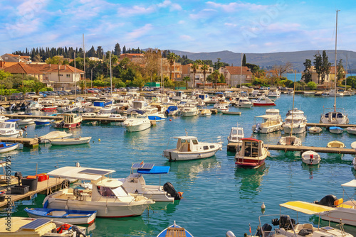 Fishing boats in harbor. Beautiful Mediterranean landscape. Montenegro, view of marina Kalimanj  in Tivat city on sunny spring day