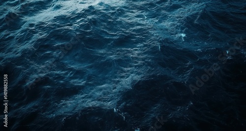 A top down view showing dark blue ocean water waves