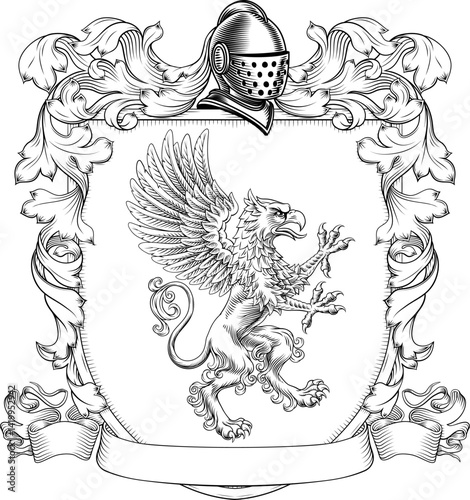 A Griffin or Gryphon coat of arms or crest family heraldry medieval heraldic animal knight shield. With helmet and acanthus filigree scroll ornament in a vintage woodcut style.