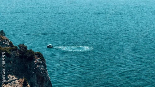 aerial landscape video of beautiful Corfu blue neon sea with small boats