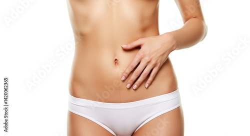 Close-up of a slim woman’s bare torso with a hand gently resting on the side of her waist
