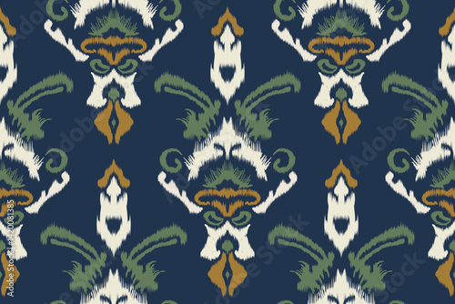 Seamless Ikat Fabric Pattern, Blue Background and Ethnic Shapes Decorated with Green, White and Gold for Textiles, Fashion Prints, Interior Design, Wallpaper and Fabric Design.