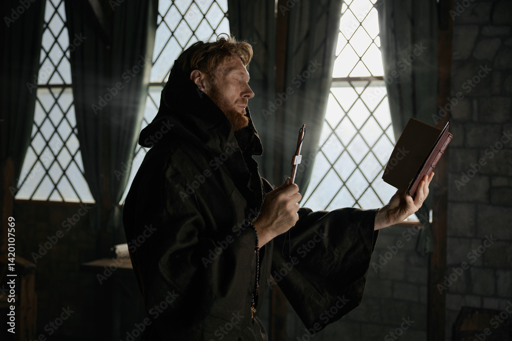 Medieval priest holding cross and holy bible performing exorcism rite