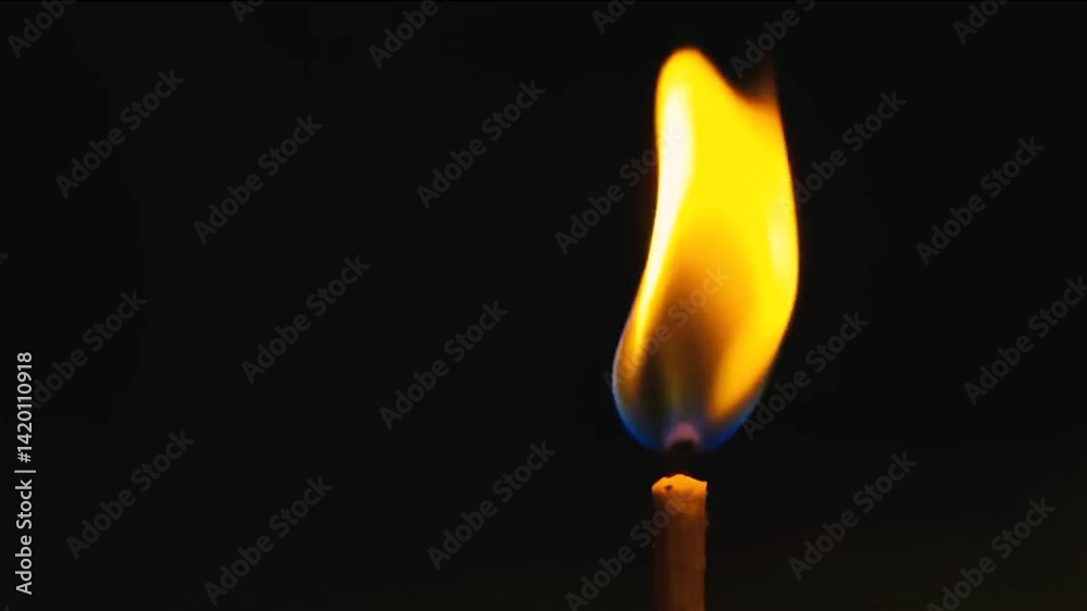 burning match on black background