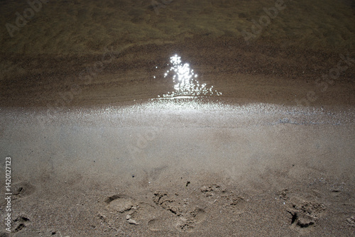 water flowing into the beach