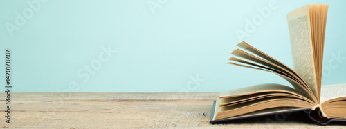 open book on a wooden table. Back to school. Education business concept. panorama, banner.