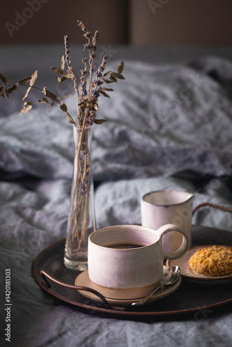 Obraz na płótnie Morning coffee on vintage metal tray in bed with grey sheet and pillows. w salonie