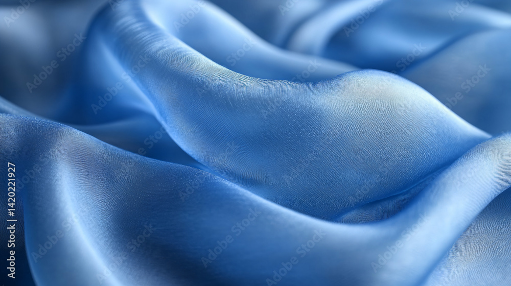 Obraz premium Flowing blue silk fabric soft textiles close-up abstract studio elegance and luxury